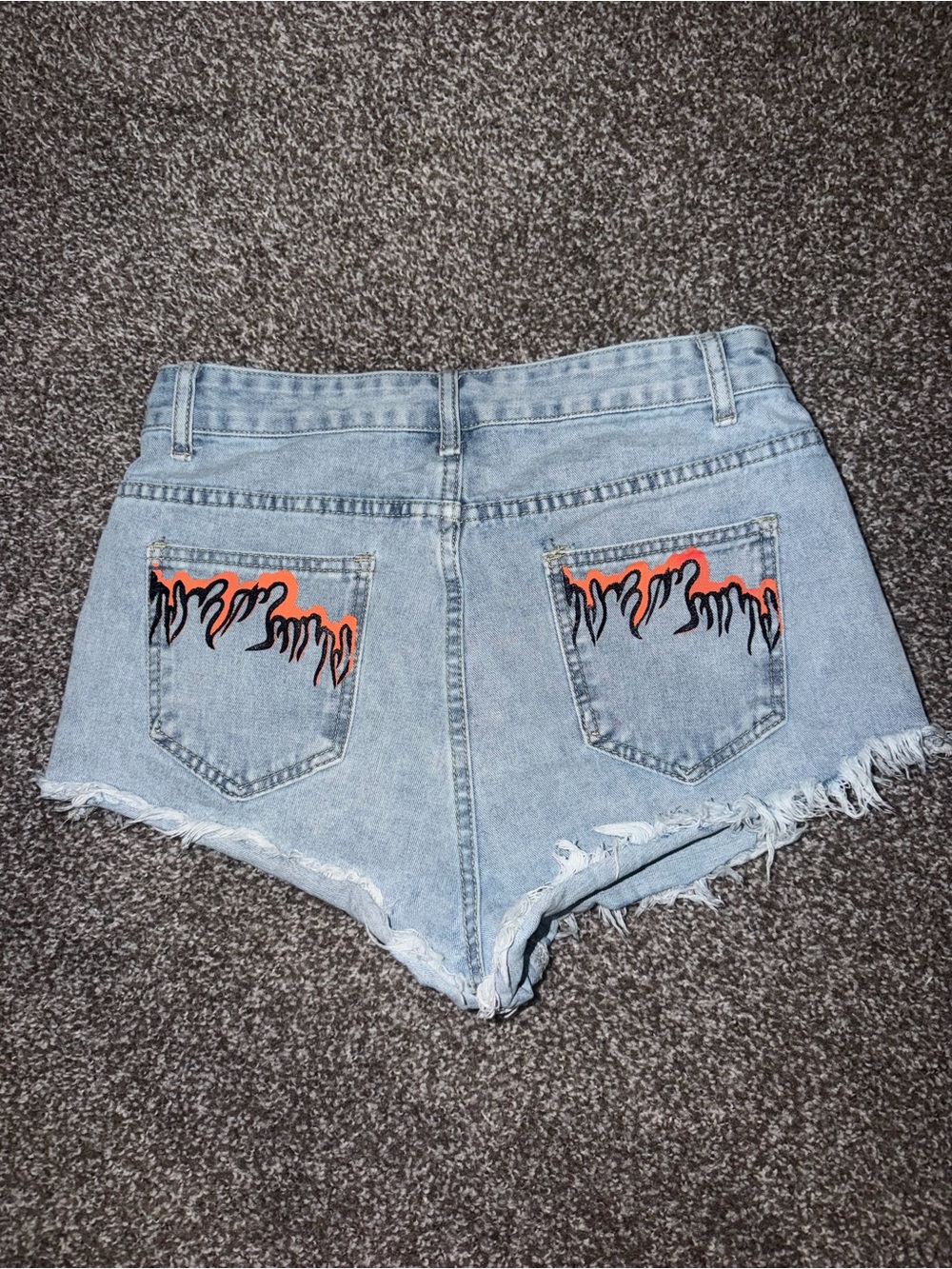 SHEIN Light Wash Denim Cutoff Shorts with Orange & Black Flame Pockets